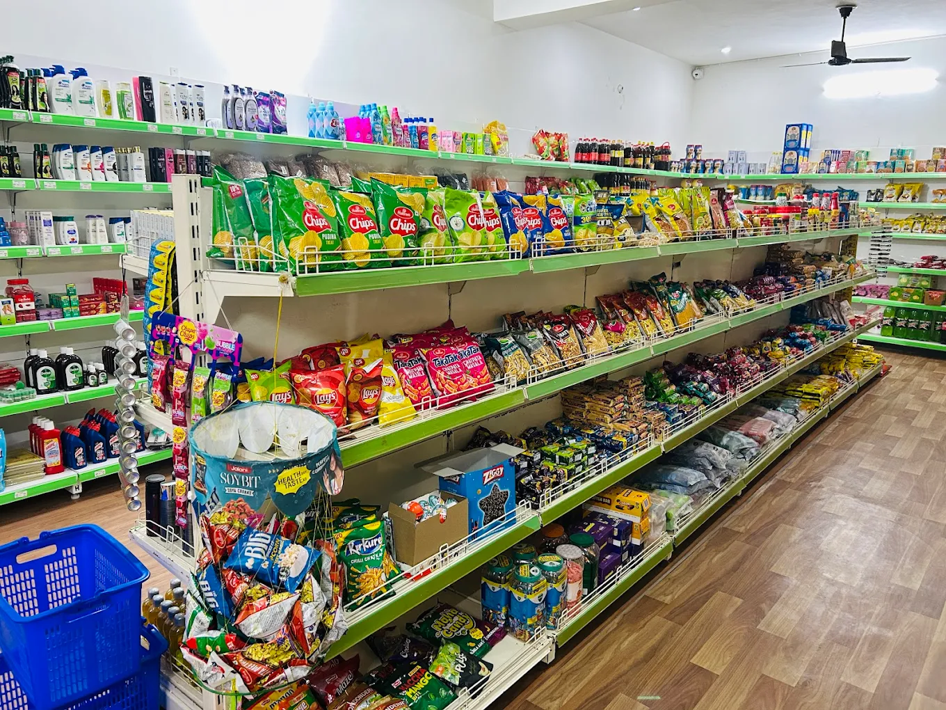 Snacks and confectionary section with biscuits, chips and chocolates at Khalsa S-Mart
